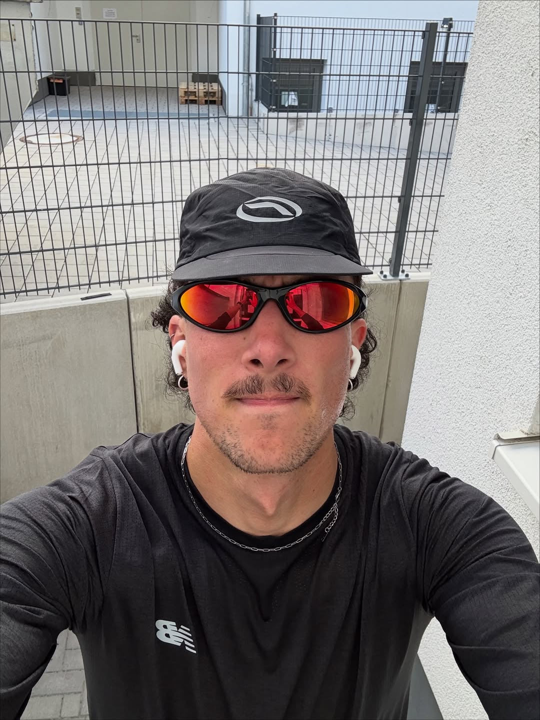 Customer wearing AIM Black Heat sunglasses — running close-up