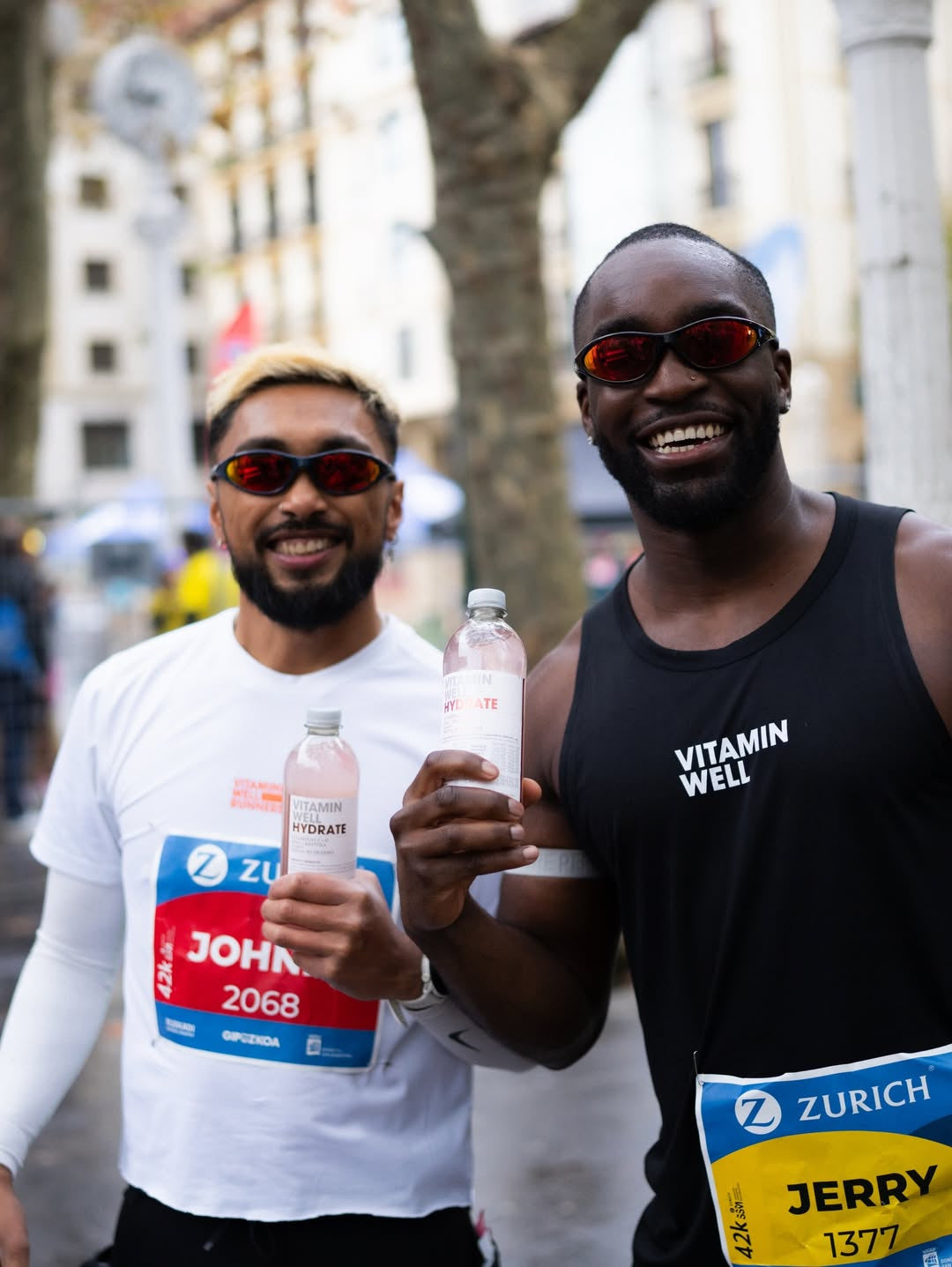 Customer wearing AIM Black Heat sunglasses — two friends portrait
