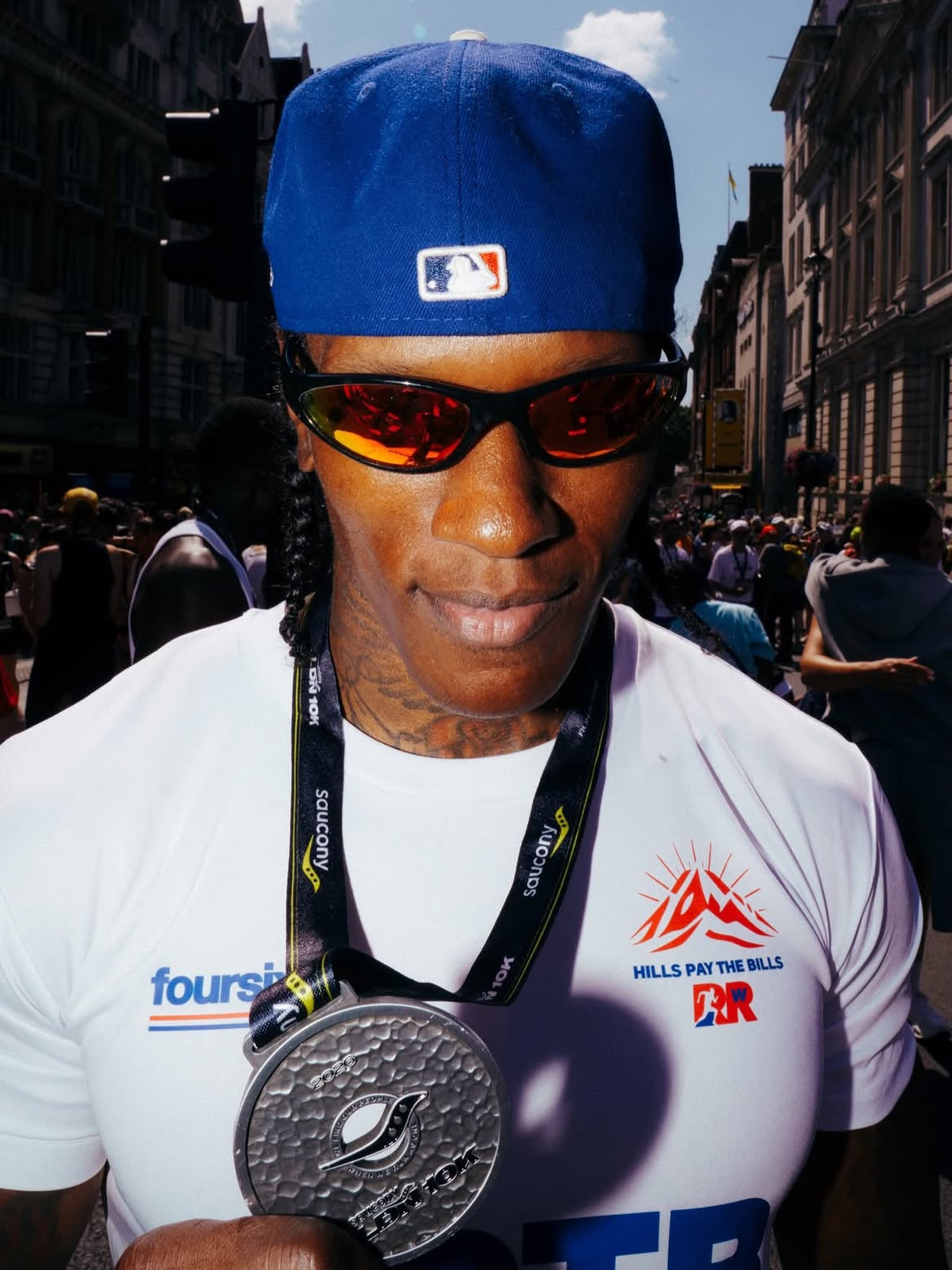 Customer wearing AIM Black Heat sunglasses — nyc post-race portrait