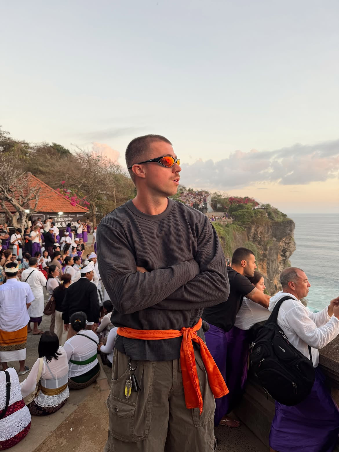 Customer wearing AIM Black Heat sunglasses — casual travel portrait