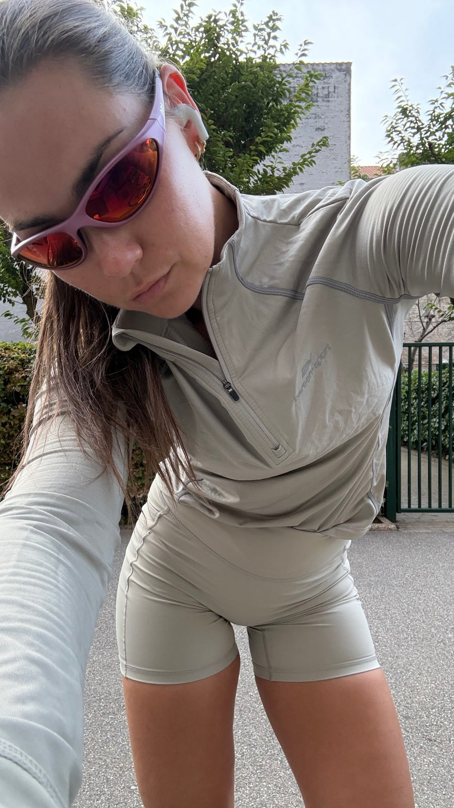 Customer wearing AIM Dusk Road sunglasses — overhead portrait