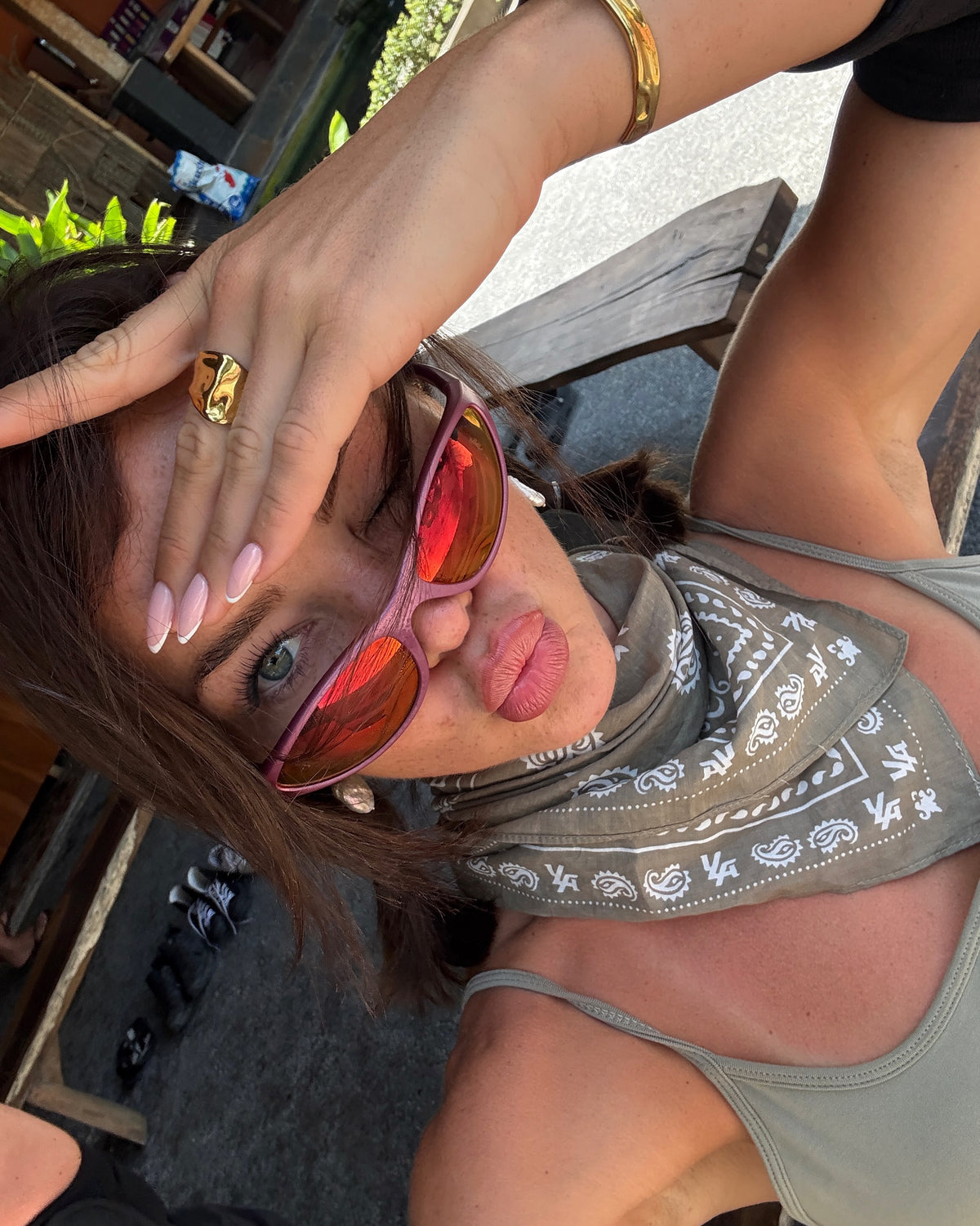 A customer wearing AIM Sunnies - Dusk Road
