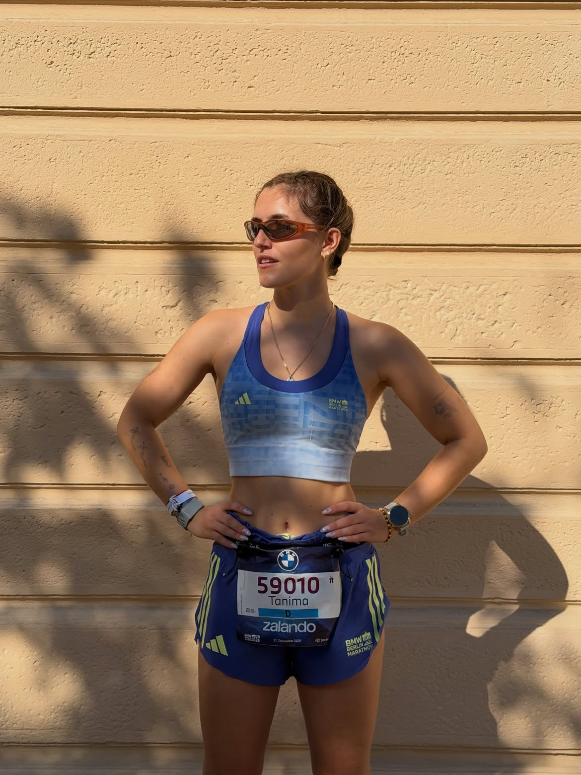 Customer wearing AIM Earth sunglasses — post-race portrait