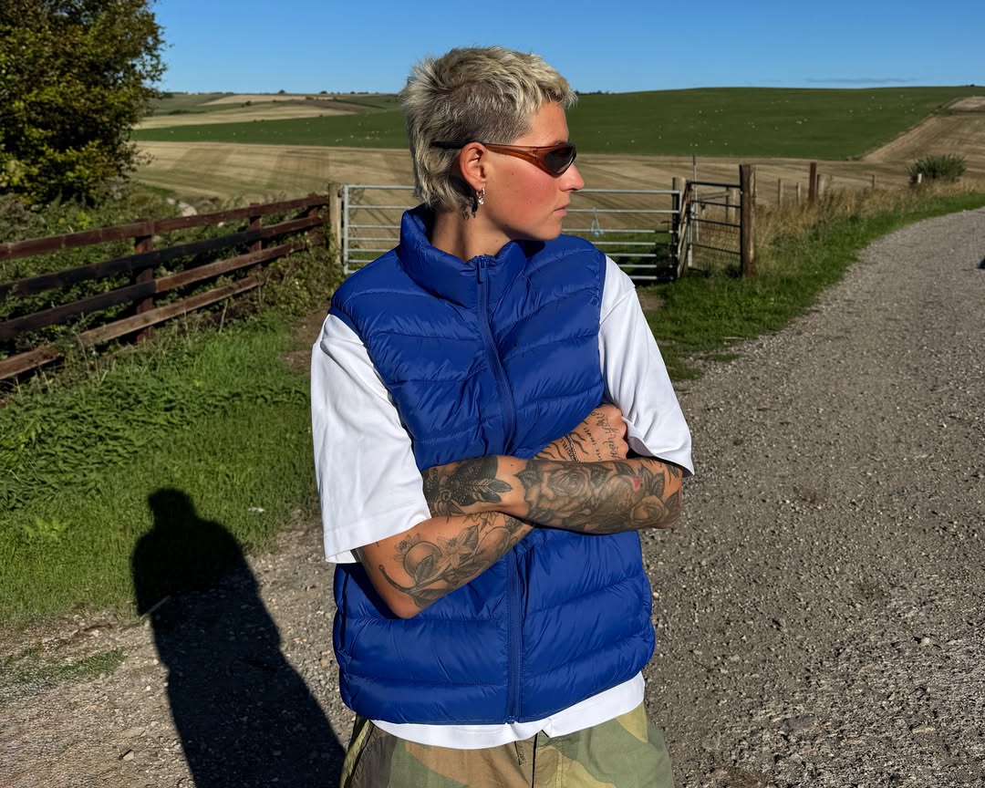 A customer wearing AIM Sunnies - Earth