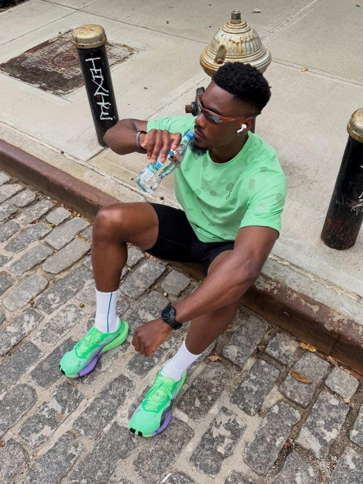 A customer wearing AIM Sunnies - Earth