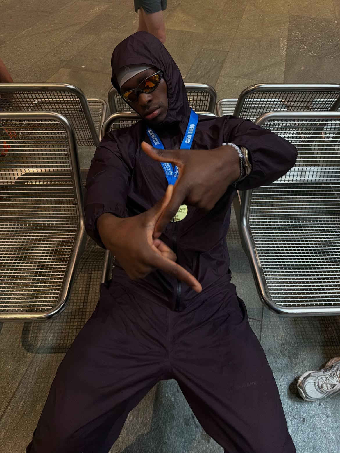 Customer wearing AIM Gunmetal sunglasses — subway portrait