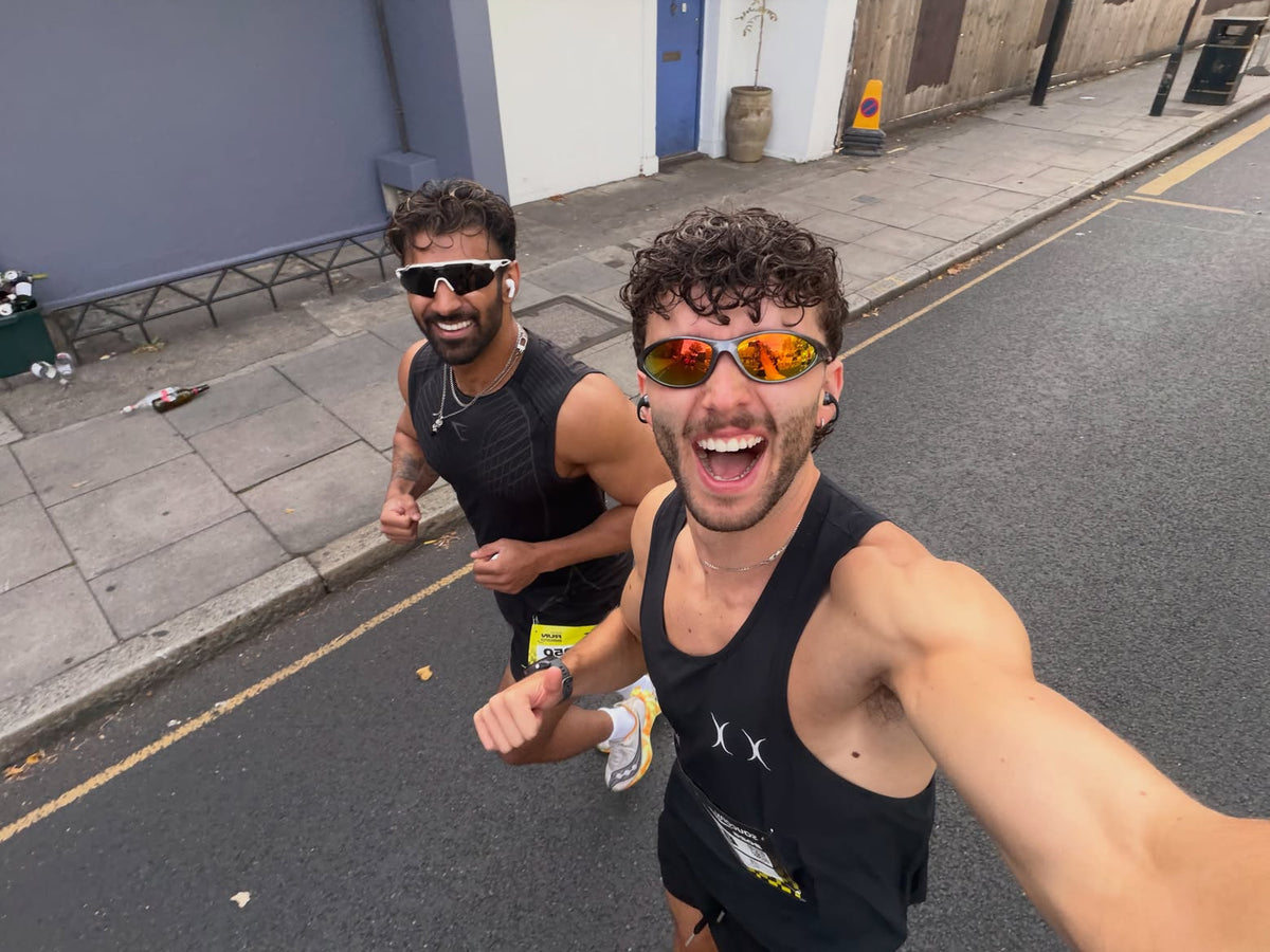 Customer wearing AIM Gunmetal sunglasses — phone portrait with friends