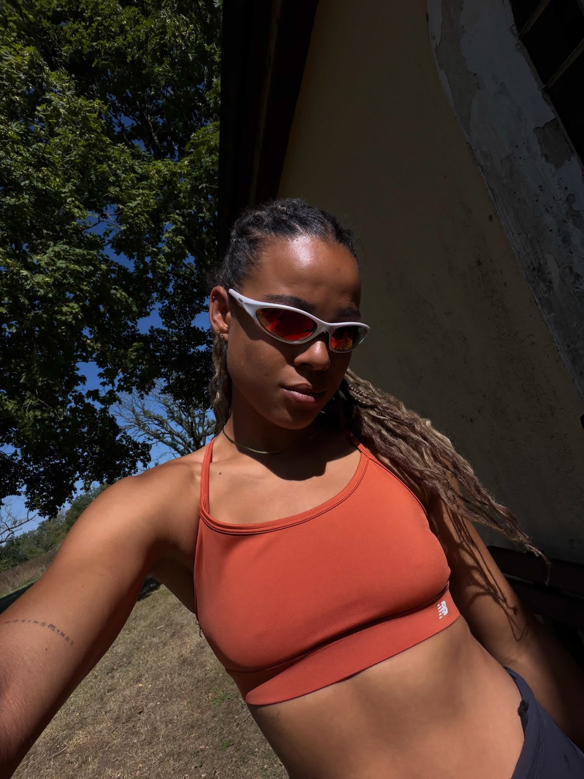 Customer wearing AIM Pearl Heat sunglasses — overhead portrait