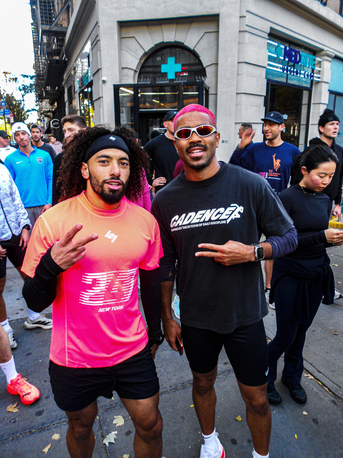 Customer wearing AIM Pearl Heat sunglasses — two friends after a race