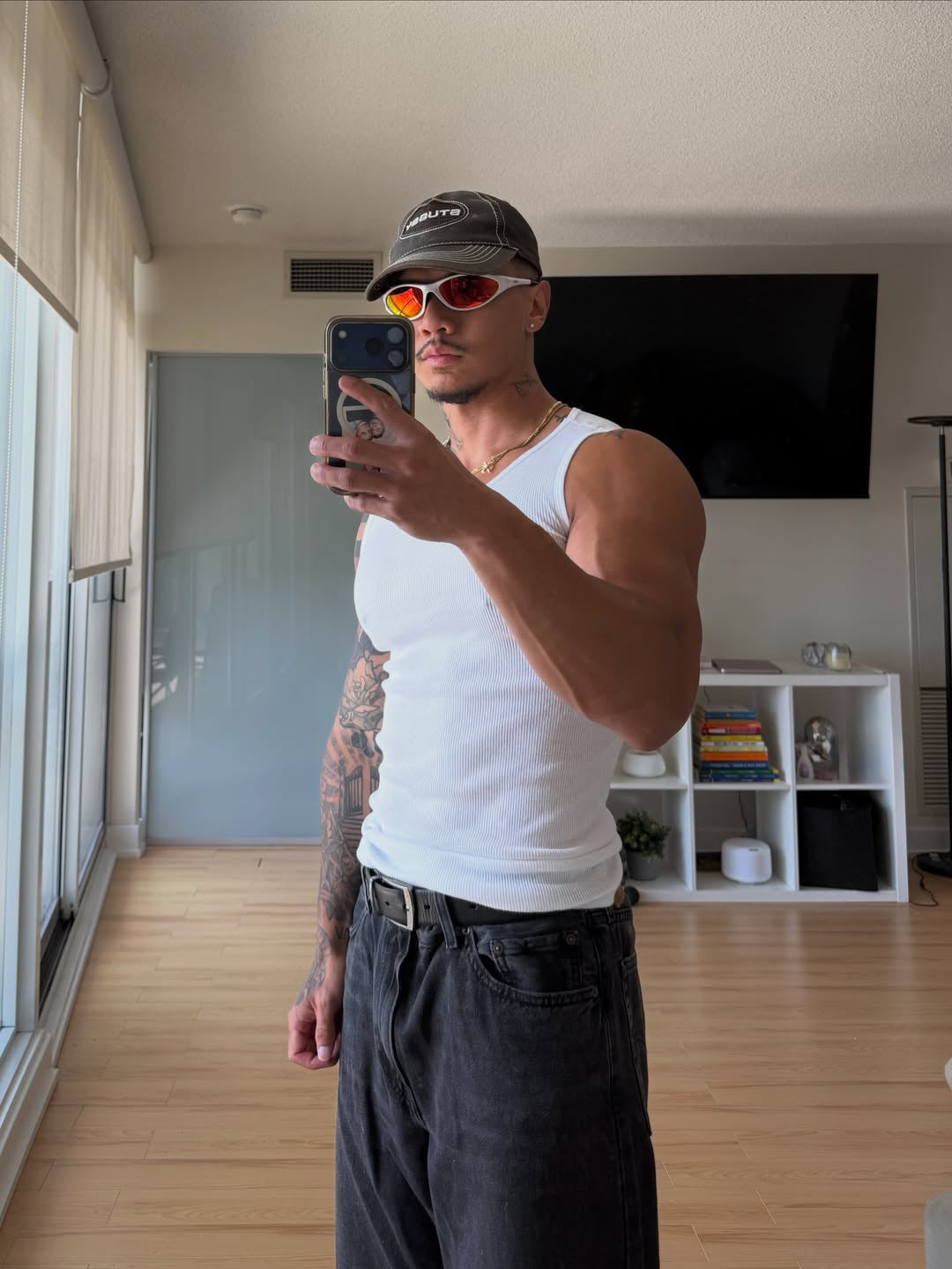 Customer wearing AIM Pearl Heat sunglasses — casual mirror portrait