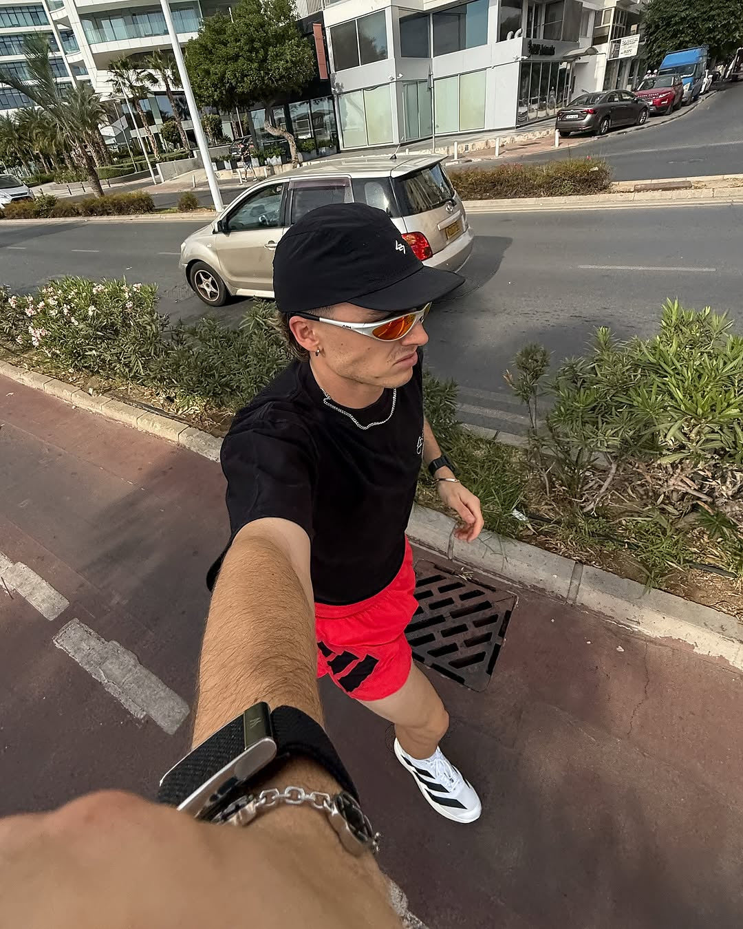 Customer wearing AIM Pearl Heat sunglasses — running portrait