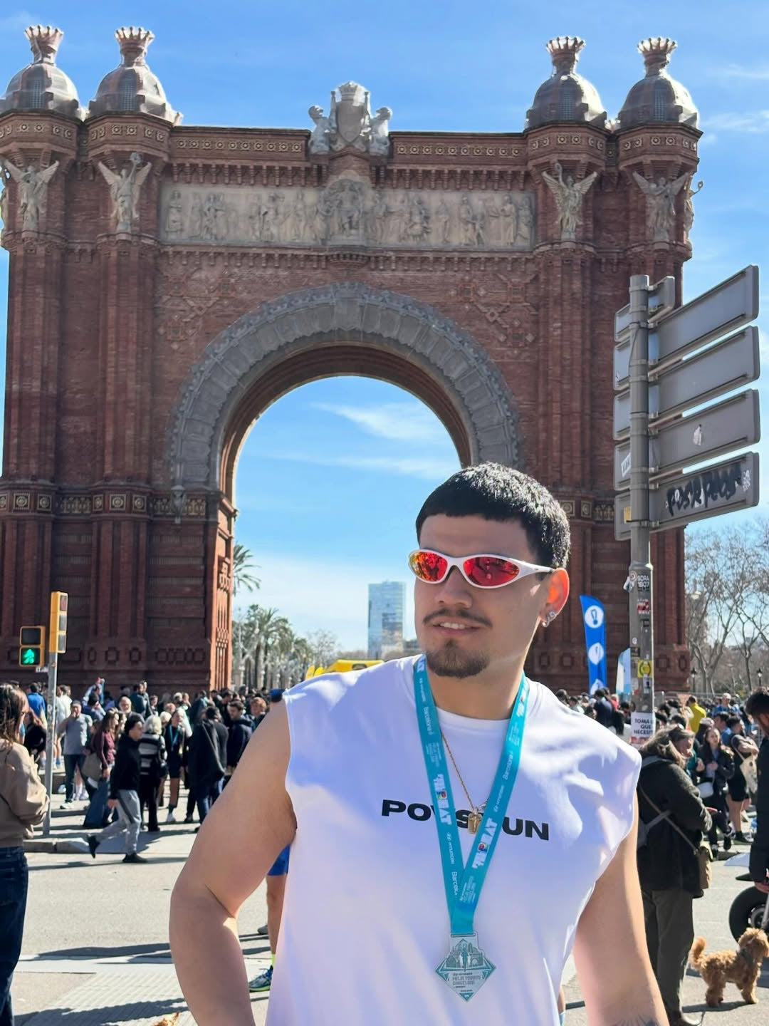 Customer wearing AIM Pearl Heat sunglasses — post-race portrait