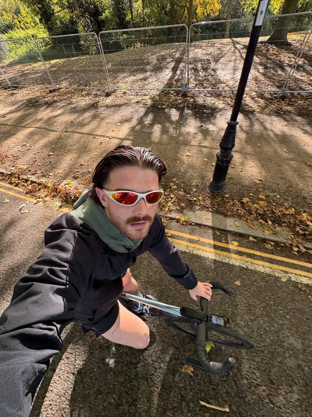 Customer wearing AIM Pearl Heat sunglasses — running portrait