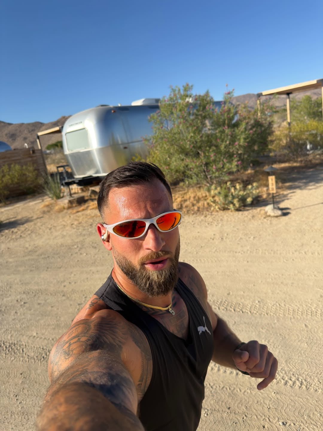 Customer wearing AIM Pearl Heat sunglasses — desert running portrait