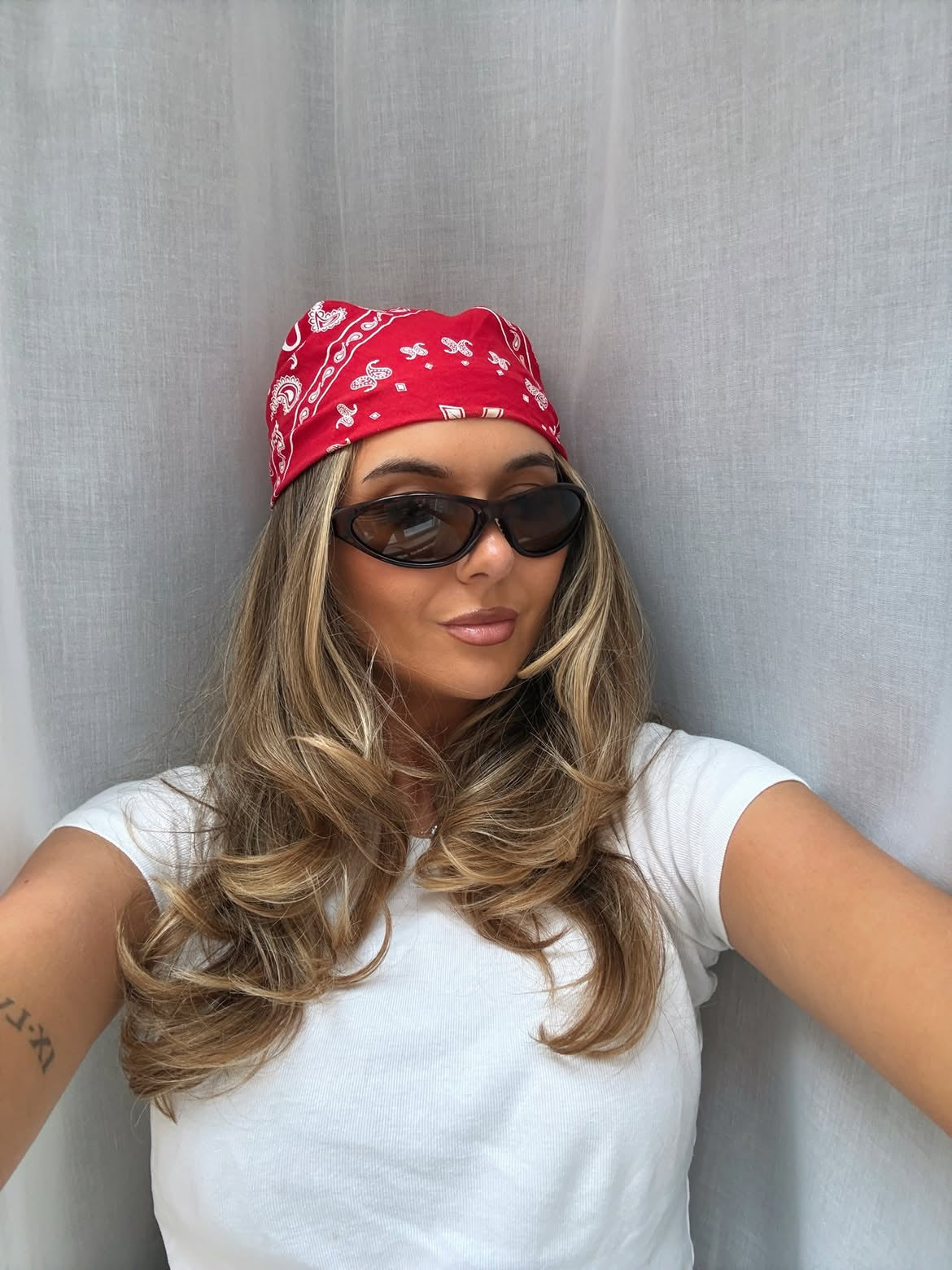 Customer wearing AIM Tortoise sunglasses — indoor bandana portrait