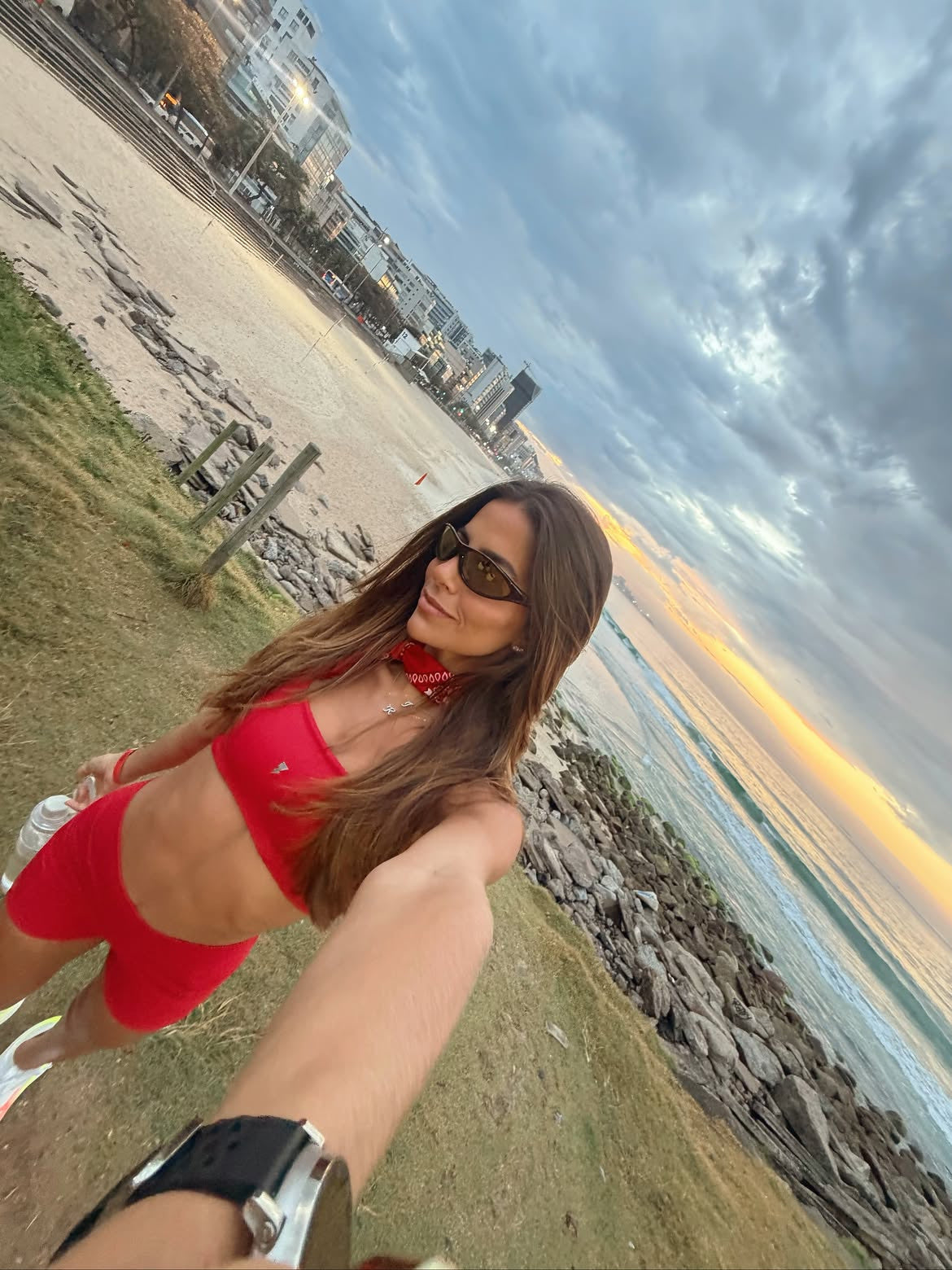 Customer wearing AIM Tortoise sunglasses — beach portrait
