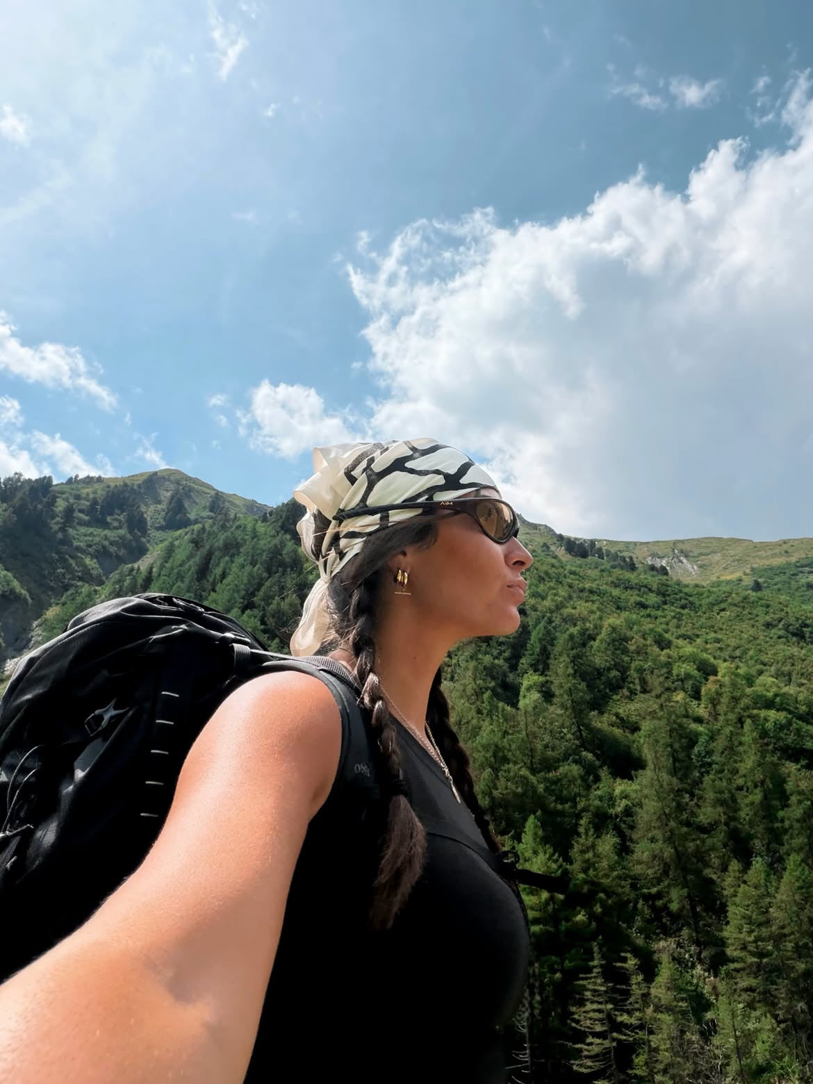 Customer wearing AIM Tortoise sunglasses — hiking portrait