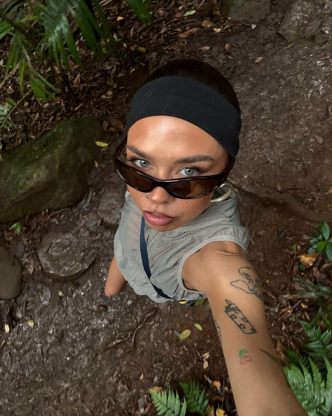 Customer wearing AIM Tortoise sunglasses — forest overhead portrait