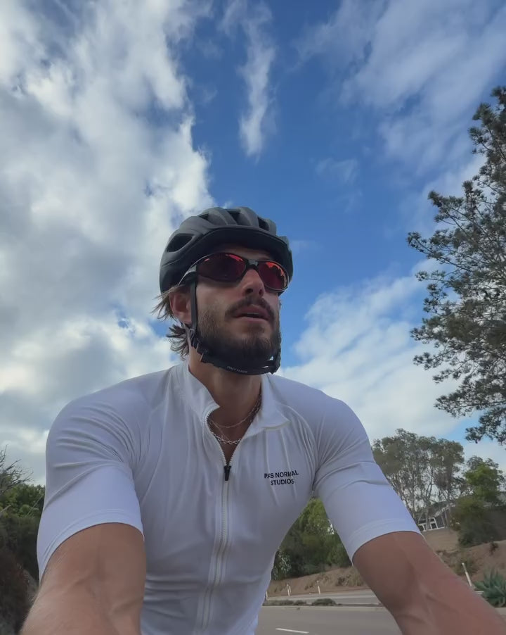 Customer wearing AIM Black Heat sunglasses — cycling video